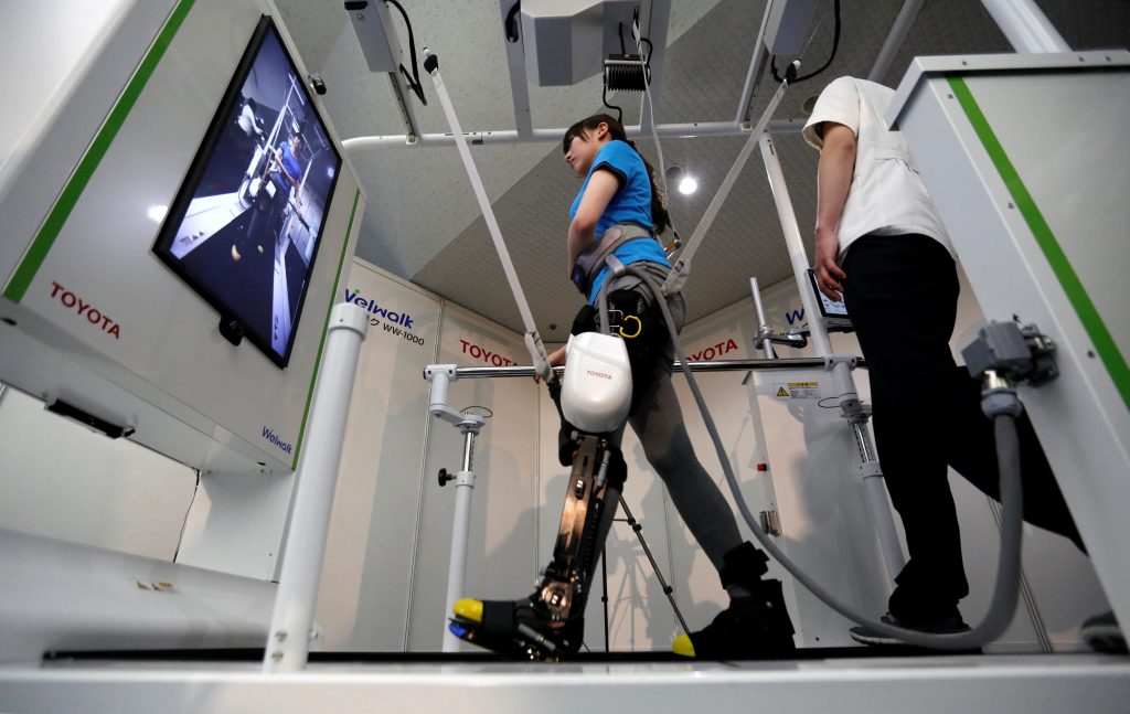 A model demonstrates Toyota’s rehabilitation robot Welwalk WW-1000. Reuters / Toru Hanai