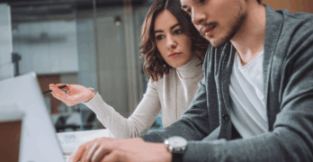 Colleagues from the marketing department discuss AI’s suggested campaign tactic